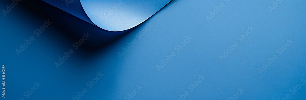 Aufkleber a blue background with an empty paper for copy space.
