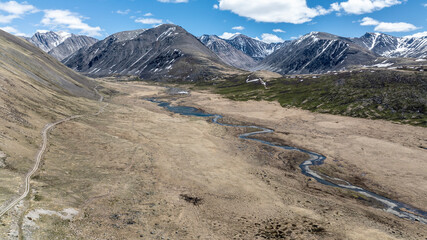 stunning landscapes of mountains, lakes and rivers from a drone flight in the southern regions of Altai in May