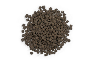 Organic-chemical fertilizer pellets on a white background