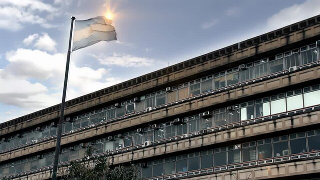 Argentine Flag Flying Over Academic Campus at Sunset, Ciudad Universitaria, Buenos Aires, 4K