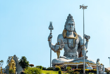 Fototapeta premium Majestic Lord Shiva Statue Against Clear Blue Sky