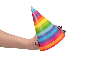 Colorful birthday cap in woman hands isolated on white background
