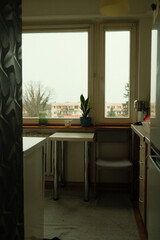 Apartment, kitchen in the house, rain outside the window, comfort