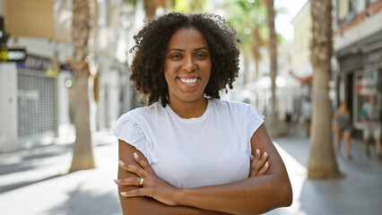 Smiling african american woman in white t-shirt outdoors