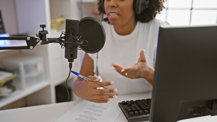 African american woman recording podcast in studio