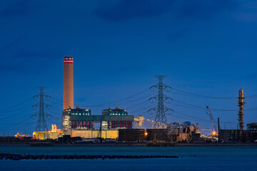 Fototapeta premium power plant factory fuel energy produce for chemical oil refinery and petrochemical business in industrial for green and eco technology business, with view of port and ocean transportation