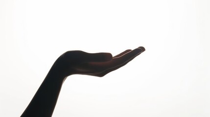 mysterious hand holding unknown object cutout silhouette on white background conceptual photography