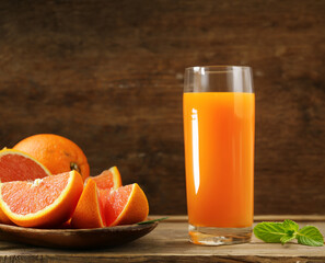ripe organic juicy orange on wooden background