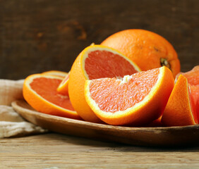 ripe organic juicy orange on wooden background