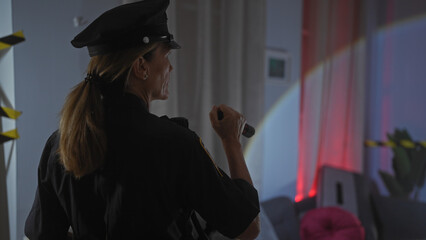 Blonde woman police officer investigating a crime scene inside a modern living room
