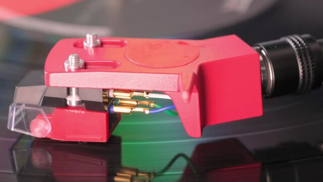 close-up pickup head of analog player, pickup stylus smoothly slides along music tracks of vinyl disc, Art of Vinyl, Analog Sound Experience, Audiophile Art and Vinyl Sounds