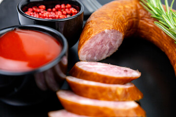 pieces of salami sausage with spices close-up