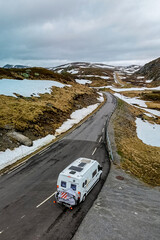 Campervan or motorhome travel camper van, at the Lyse road covered with snow to Krejag Norway Lysebotn, road covered with snow 