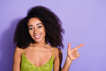 Photo of cute pretty cheerful woman wear trendy clothes presenting empty space news isolated on violet color background