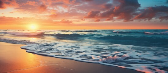Fototapeta premium Sunset on the beach shore with a captivating view and ample copy space image available.