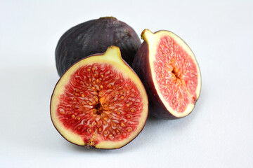 a group of figs in the white background close up 