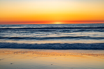 Sun appears at horizon near Corolla in Outer Banks, North Carolina