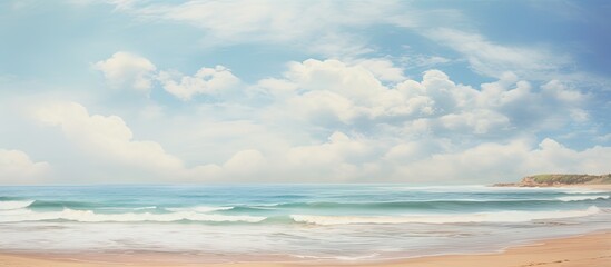 Fototapeta premium Surf gently meeting the sandy shore against the scenic horizon in a copy space image.