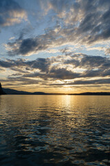 Beautiful sunset on the lake Lucerne, Switzerland. Panoramic view on the lake and mountains