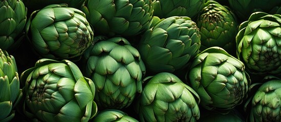 Fototapeta premium Numerous green artichokes filling up the copy space image.
