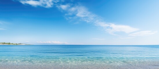 Obraz premium Tranquil seaside scene with a clear blue sky and ample copy space image.