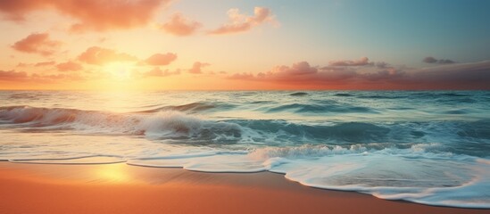Fototapeta premium A breathtaking image of a serene beach at sunset with ocean waves, offering a peaceful paradise vibe and plenty of copy space image.
