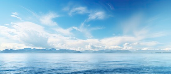 Fototapeta premium Scenic view of the horizon over the sea with a vast expanse of ocean and sky, providing a tranquil setting for a copy space image.