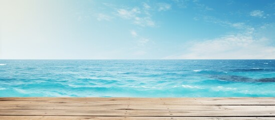 Product placement on a blue wooden board with a shimmering sea in the background, creating a summer holiday theme for a copy space image.