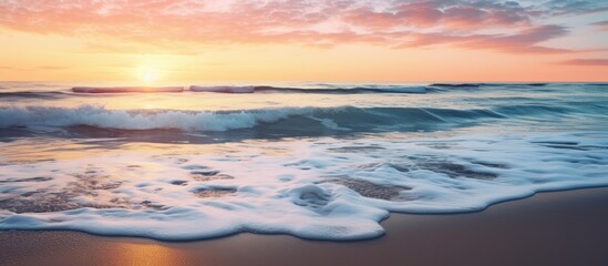 Obraz premium A breathtaking image of a serene beach at sunset with ocean waves, offering a peaceful paradise vibe and plenty of copy space image.