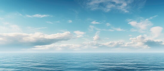 Fototapeta premium Scenic view of the horizon over the sea with a vast expanse of ocean and sky, providing a tranquil setting for a copy space image.