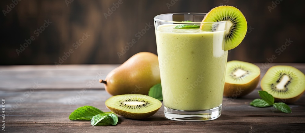 Poster Smoothie featuring a blend of pear, kiwi, and ginger, presented on a rustic background with ample copy space image.