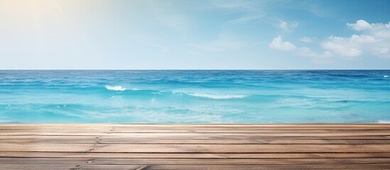 Product placement on a blue wooden board with a shimmering sea in the background, creating a summer holiday theme for a copy space image.