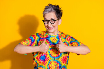 Photo of glad nice lovely woman wear stylish print clothes thumb up isolated on vivid yellow color background