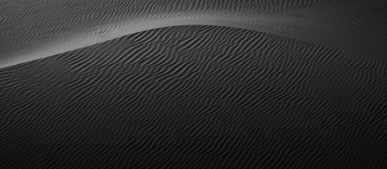 Black and white textured sand background in a copy space image.