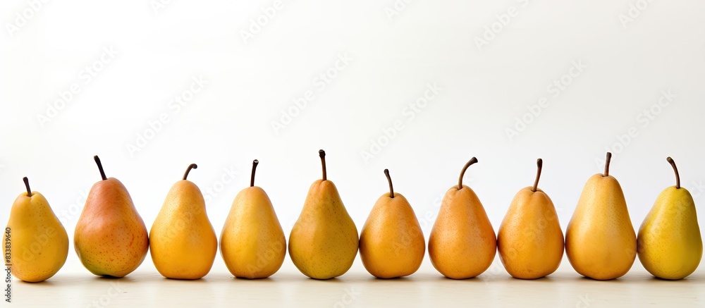 Poster A scene showing ripe pears arranged neatly on a clean white surface with empty space for text or other elements in the image. with copy space image. Place for adding text or design