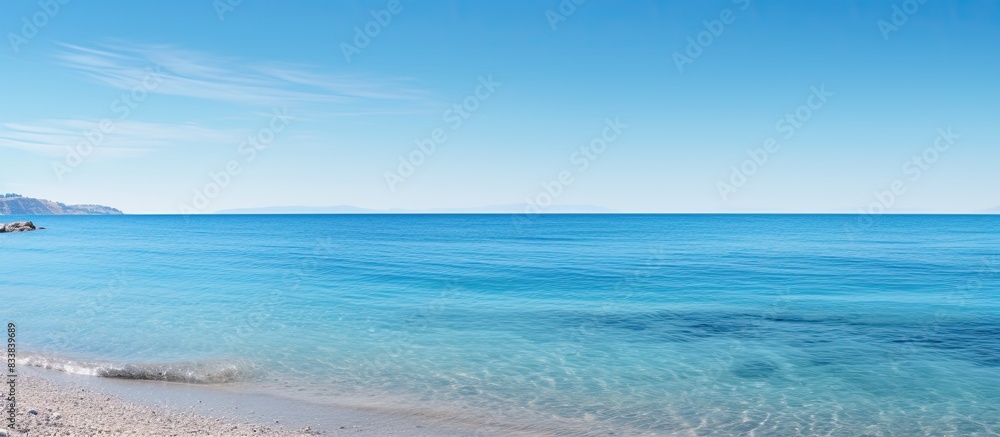 Poster tranquil seaside scene with a clear blue sky and ample copy space image.