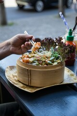hand holding a plate with food