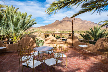 Restaurant terrace in luxury lodge hotel near Agdz town with view of Jebel Kissane mountain in...