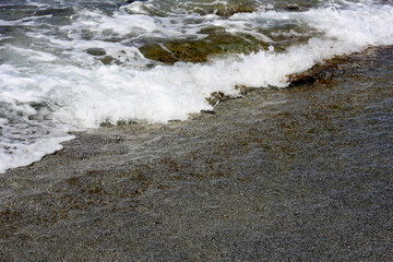 Waves with foam of the sea.