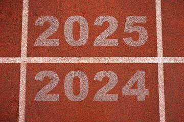 Rear view of a athlete preparing to start on an athletics track engraved with the year 2025, business strategy concept.