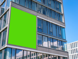 City Centre Downtown Tall Skyscraper modern building with green screen advertising billboard cut out - Powered by Adobe