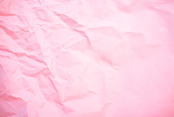 Crumpled pink background paper sheet texture. Pale pink craft background.Old textured paper copy...
