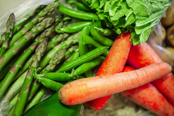 Asparagus officinalis bundle. Ripe green peas. Whole avocado. Orange carrots. Organic raw grocery...