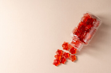 Fruit jelly gummy vitamins in a jar, food supplement.