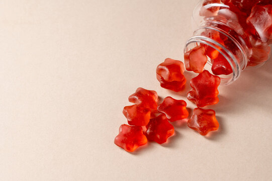 Fruit jelly gummy vitamins in a jar, food supplement.