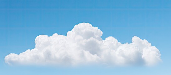 A white cloud against a blue sky with copy space image.