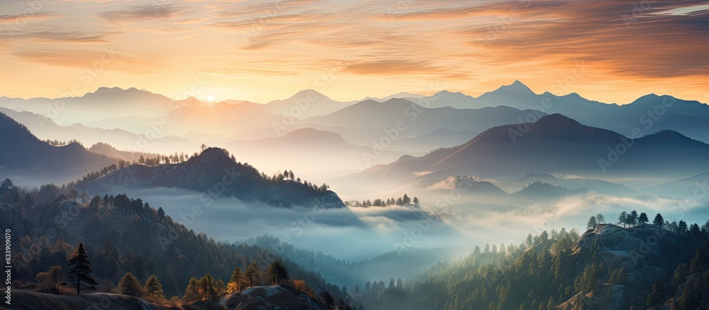 Poster mountain sunrise with mist creating an ethereal atmosphere, perfect for a copy space image.
