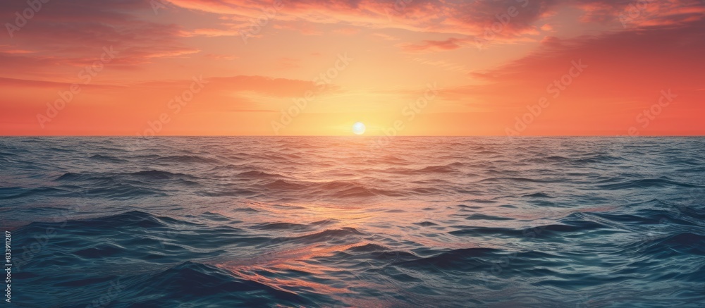 Aufkleber Sun setting over the ocean with copy space image.