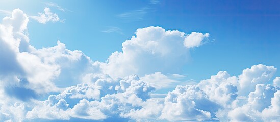Sky with clouds and a blue hue, suitable as a copy space image.