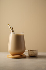 Healthy chocolate protein shake drink with straw, and protein powder
